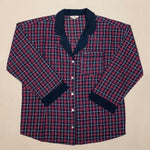 Burgundy and blue plaid shirt with navy trim on a beige background