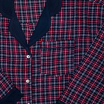 Red and navy plaid shirt with navy blue accents on a neutral background