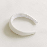 Ivory satin bridal headband made with a premium cotton braid