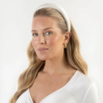 Ivory satin bridal headband made with a premium cotton braid