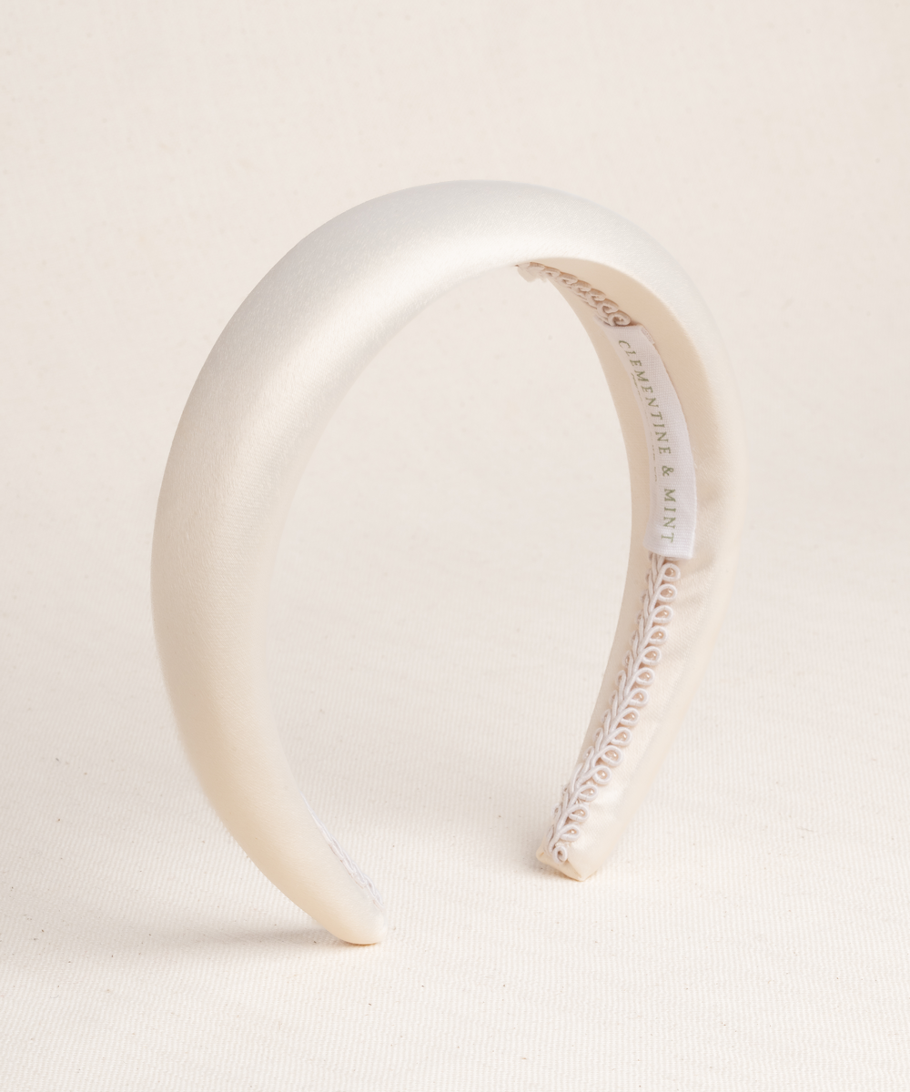 Ivory satin bridal headband made with a premium cotton braid