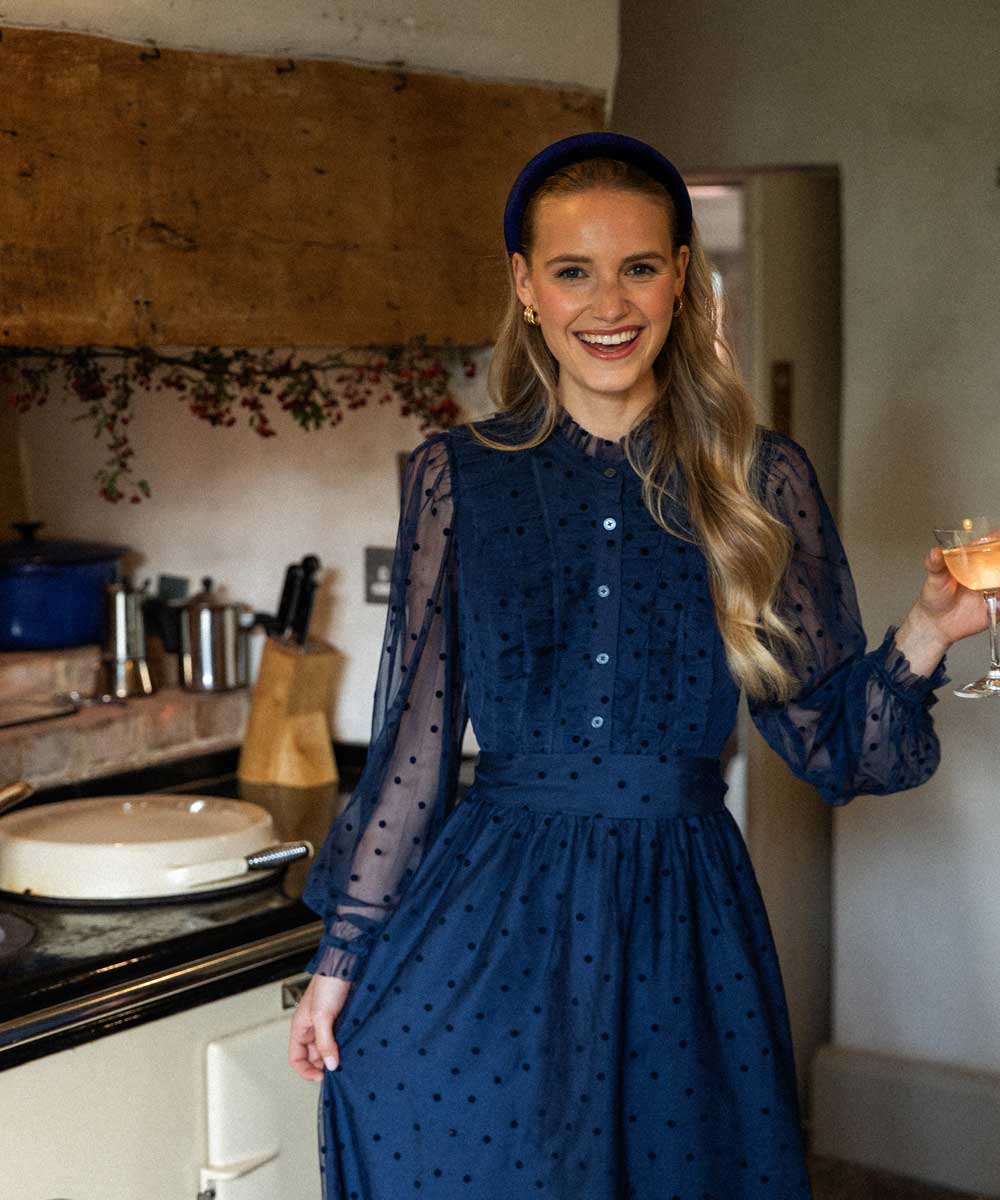 women dancing in kitchen wearing navy velvet headband