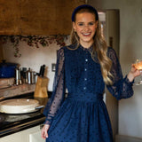 women dancing in kitchen wearing navy velvet headband