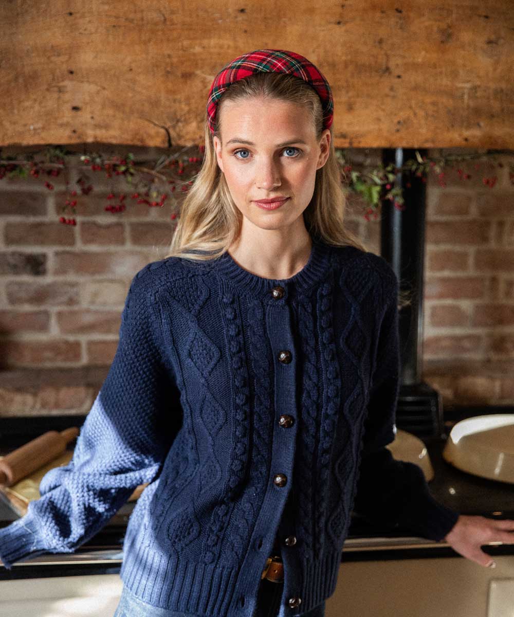 women wearing red tartan headband