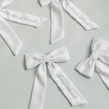 THE WHITE SATIN CLASSIC BOW