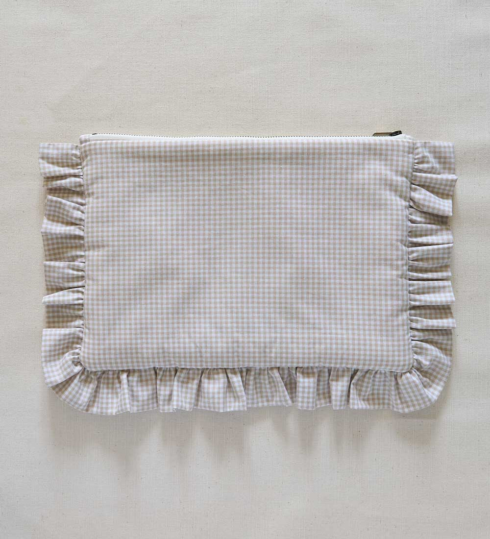 Beige Gingham Fabric pouch with ruffled edge on a beige background