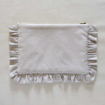 Beige Gingham Fabric pouch with ruffled edge on a beige background
