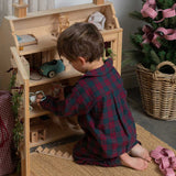 child wearing a burgundy tartan pyjama 
