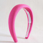 hot pink headband on beige background