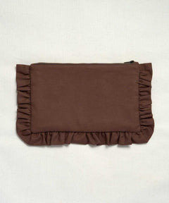 A brown fabric clutch or pouch with ruffled trim on all sides, photographed flat against a light off-white textured background.