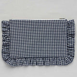 Blue and white checkered pouch with ruffled edges on a light gray background