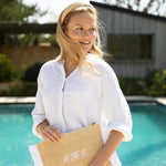 women holding raffia clutch with raffia headband