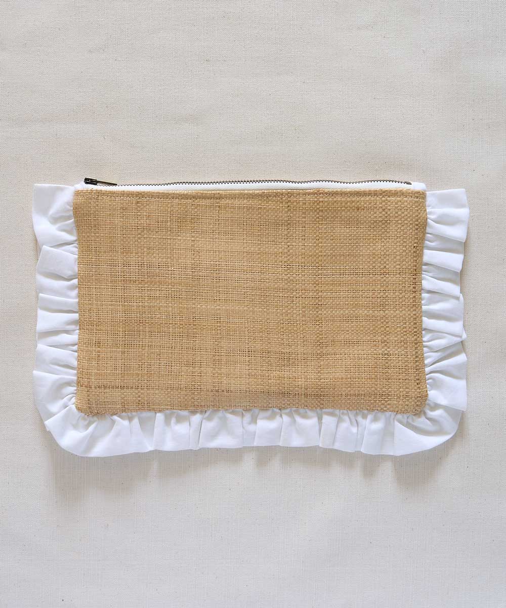 Pouch with ruffled white edge and woven brown center on a light beige background
