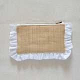 Raffia Pouch with ruffled edge and natural fabric center on a beige background