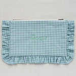 Green gingham clutch bag with ruffled edge on a light gray background