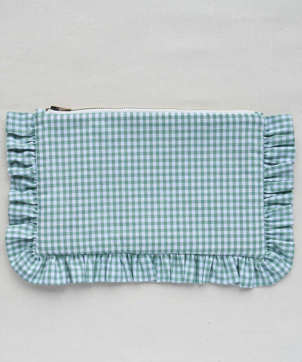 Sage Green and white gingham pouch with ruffled edges on a light gray background