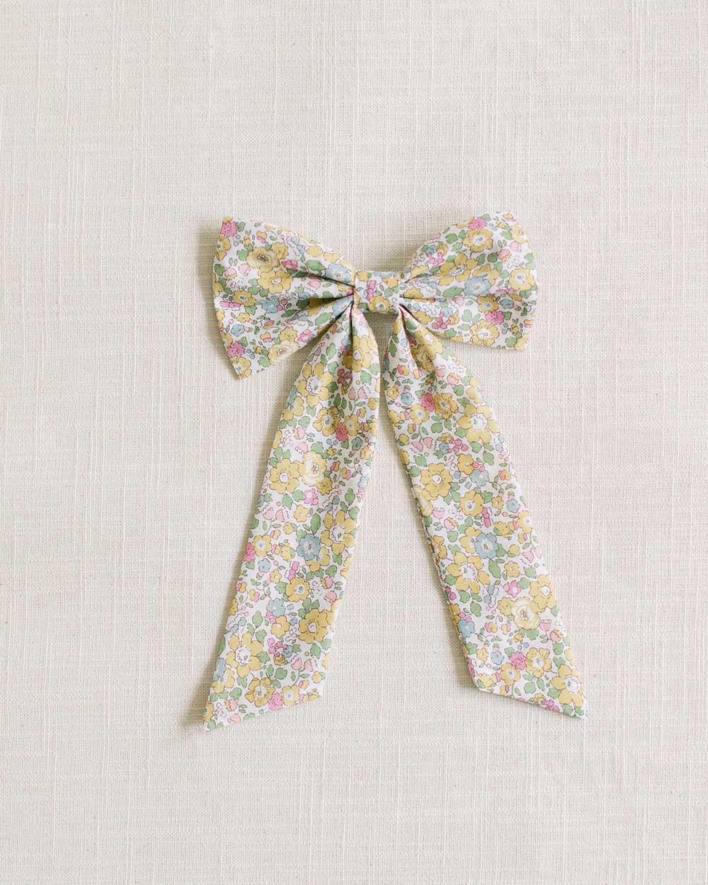 THE YELLOW FLORAL CHILDREN'S BOW MADE WITH LIBERTY FABRIC