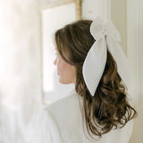 THE WHITE SATIN BOW